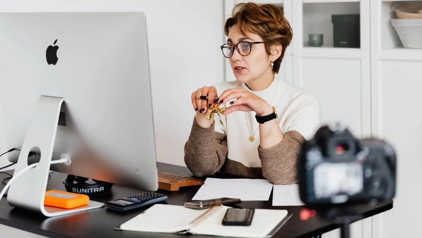 confident-elegant-lady-in-eyeglasses-hosting-webinar