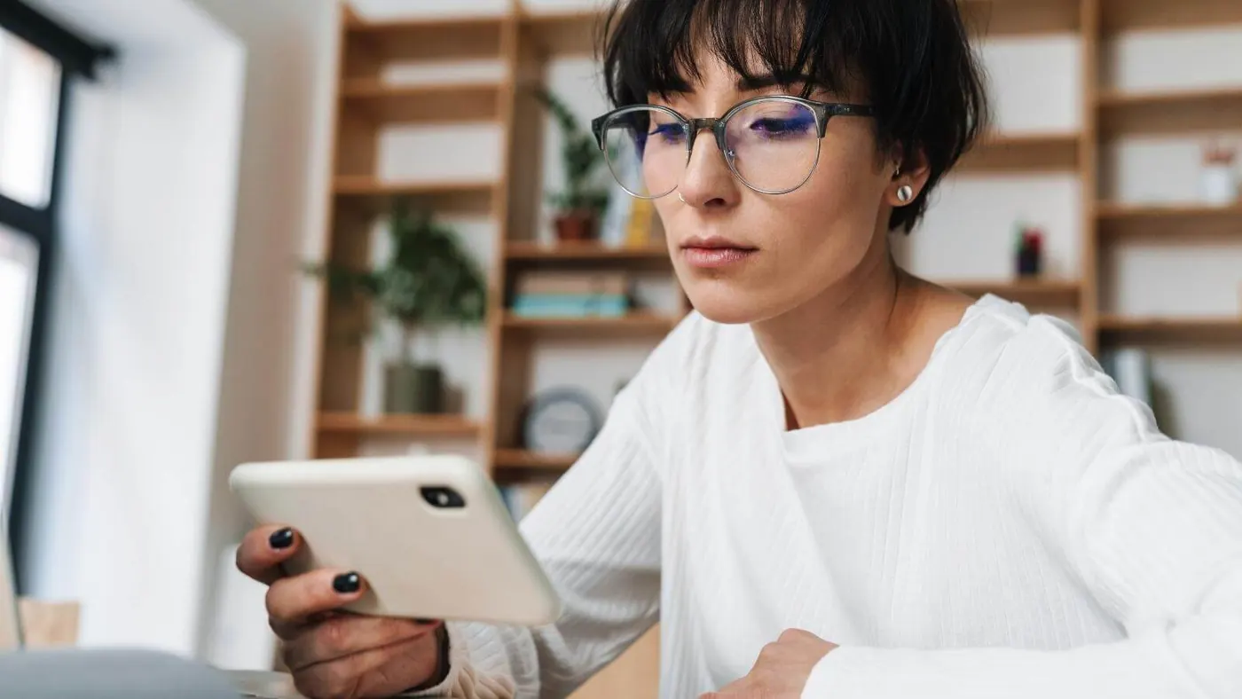 Woman reading email on phone.