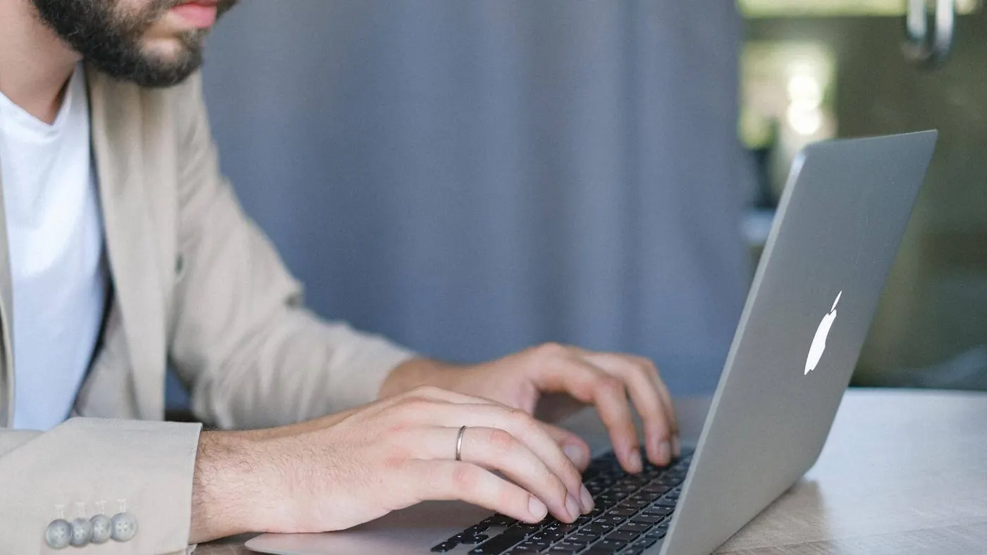 businessman-browsing-portable-laptop-indoors-5325051/ 