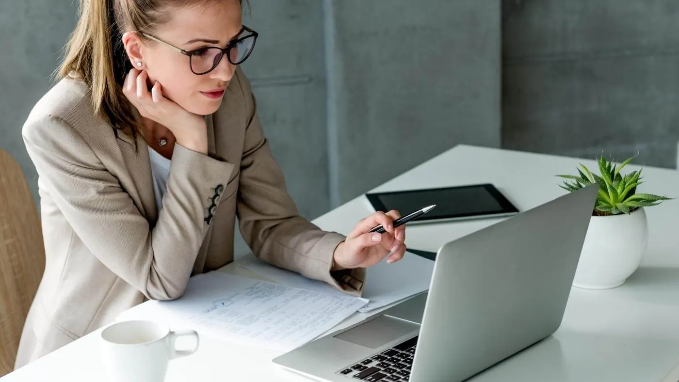 woman looking at laptop
